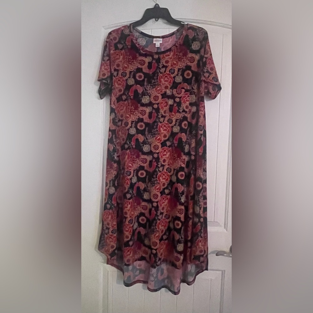 LuLaRoe Carly dress size Large. Pink/ red peacock on dark blue background.